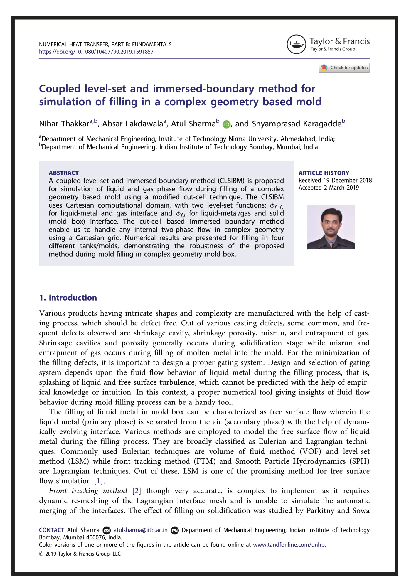 Coupled level-set and immersed-boundary method for simulation of filling in a complex geometry based mold